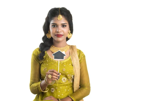 Happy Indian Traditional Young Woman Holding Little House Cutout Board — Stock Photo, Image