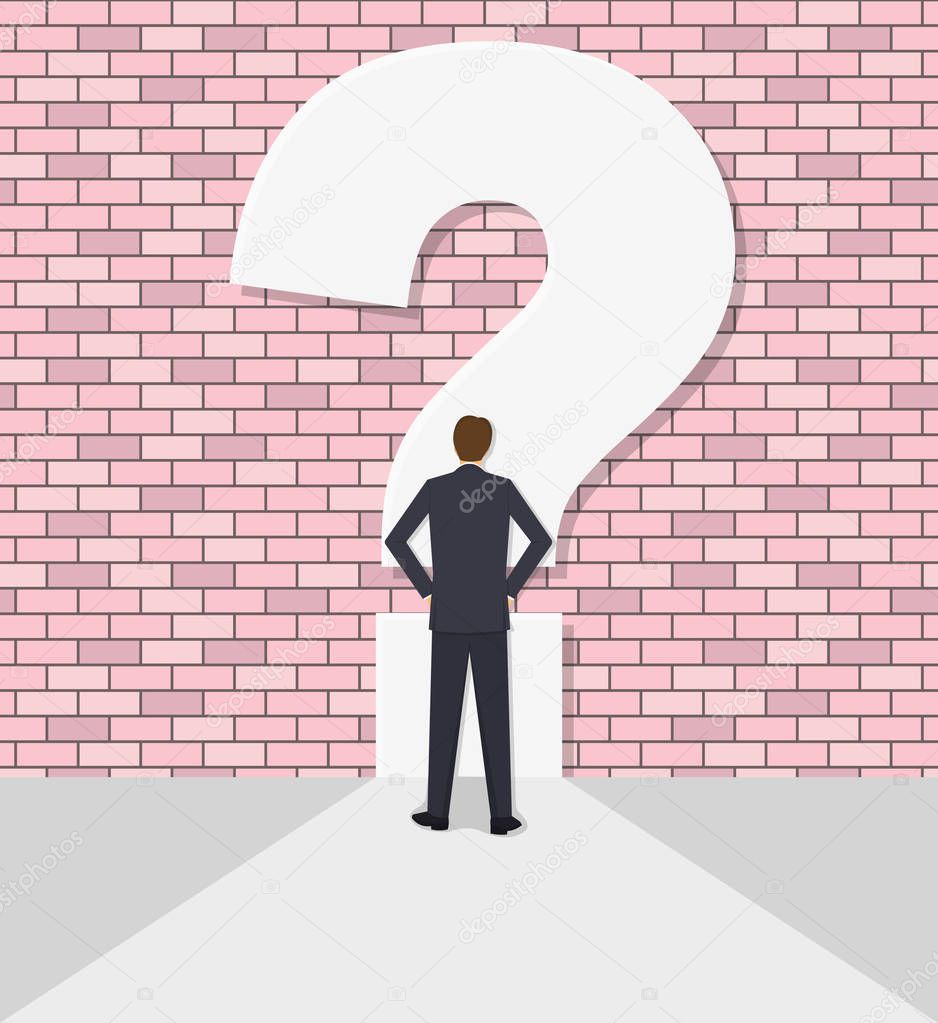  businessman rests against a wall with a question mark