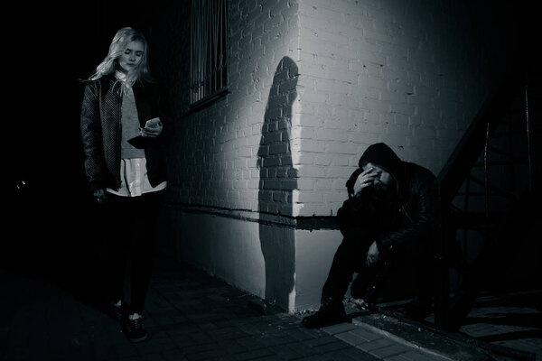 crime concepts robbery concepts a robber aimed his sharp knife at a woman to rob her valuable things in bag