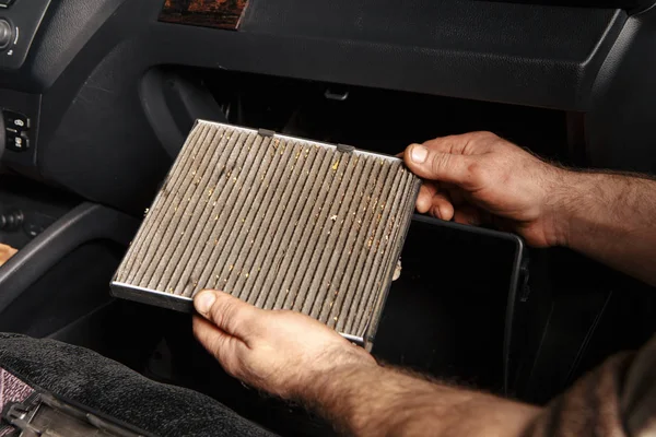 worn cabin air conditioner filter of car