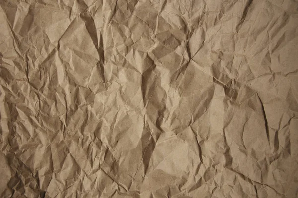 Bruine ruwe verfrommeld gerecycleerd papier textuur — Stockfoto