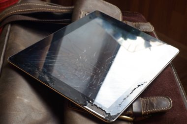 Tablet computer with broken screen clipart