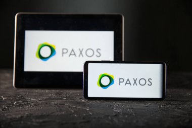 Tula 24 09 2019: Paxos on the tablet and phone display.