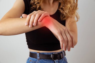 Woman with hurt hand. Rheumatoid concept.