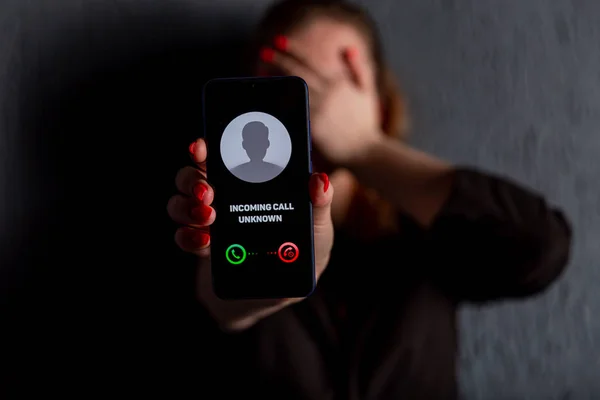 Phone call from unknown number. Scam, fraud or phishing with smartphone concept. Prank caller, scammer or stranger. Woman answering to incoming call. Hoax person with fake identity. — Stock Photo, Image