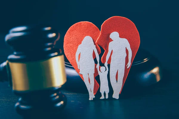 Family figure and gavel on table. Family law