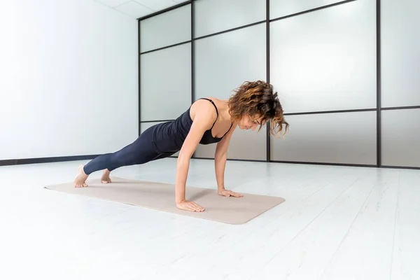 Yoga power. Exercises indoor in the studio. Active healthy life concept.