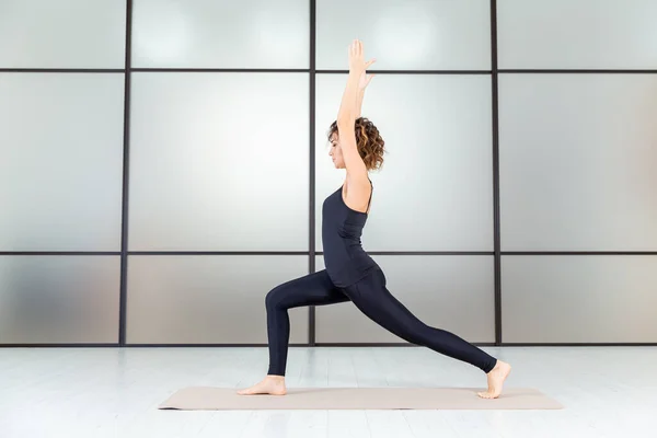 Yoga power. Exercises indoor in the studio. Active healthy life concept.
