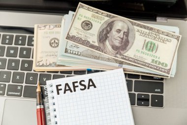 Fafsa. Student aid application form on the tablet. clipart