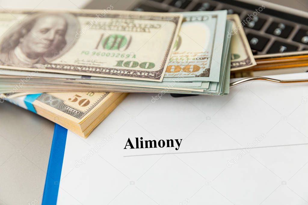 Alimony statement empty document on the table and money isolated.