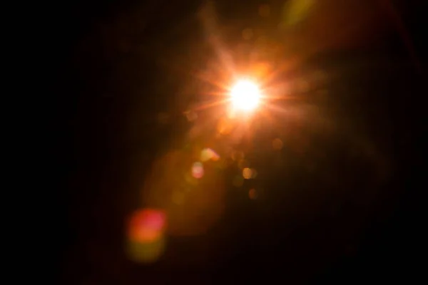 Abstract Natural Sun flare on the black — Stock Photo, Image