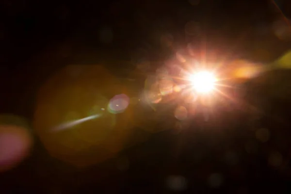 Abstract Natural Sun flare on the black — Stock Photo, Image