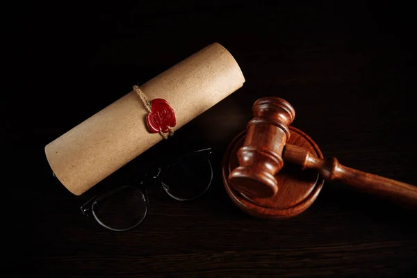 Last will and testament and glasses with wooden gavel