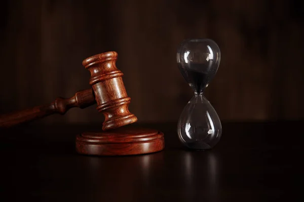 Judge gavel and hourglass. Law and time concept