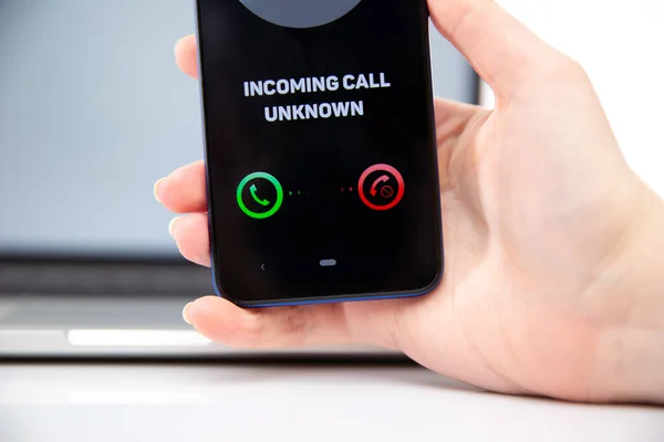 Incoming unknown call concept. Woman holding phone.