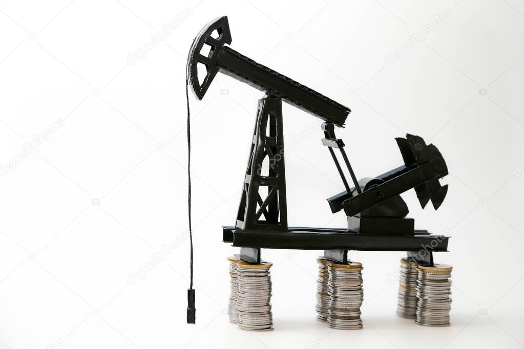 Paper mock-up of the oil pump, extraction of minerals, coins, mining