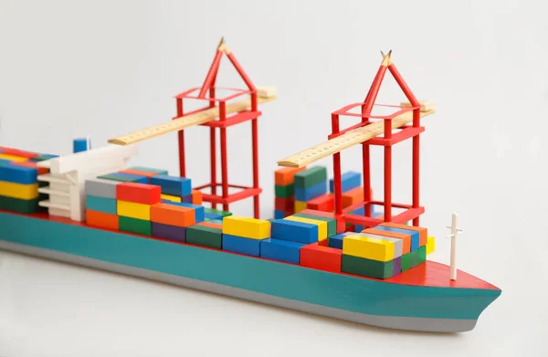 Mock ship on white background, colored containers, wooden toy, — Stock Photo, Image