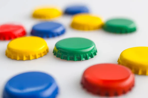 Colored plugs on white background, red, blue, green, yellow — Stock Photo, Image