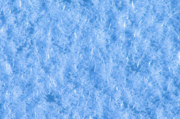 Flocos de neve no gelo . — Fotografia de Stock