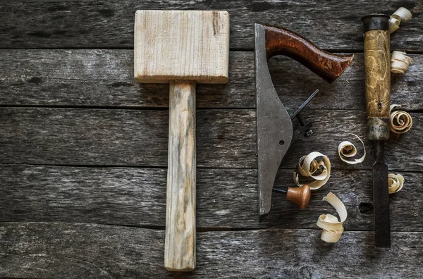 Carpentry tools on an old board table — Stock Photo, Image