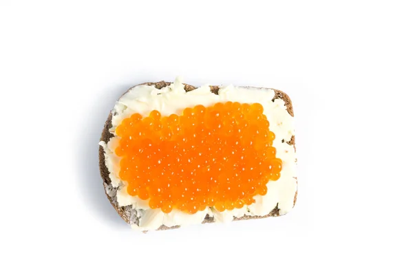 Red caviar and butter smeared on a piece of black bread — Stock Photo, Image