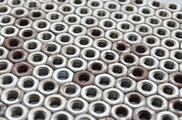 Background of metal mounting nuts. — Stock Photo, Image