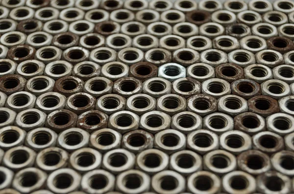 Background of metal mounting nuts. — Stock Photo, Image