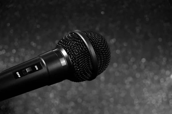 Black microphone with gray bokeh background.Close up. — Stock Photo, Image