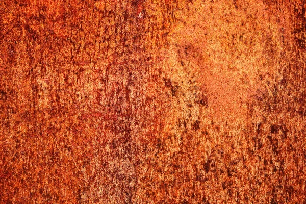 Ljust orange, rostig konsistens på en gammal metallplåt. — Stockfoto