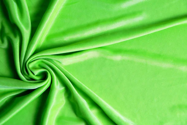Textur, abstrakt bakgrund, silke grönt tyg konstnärligt upplagd. — Stockfoto