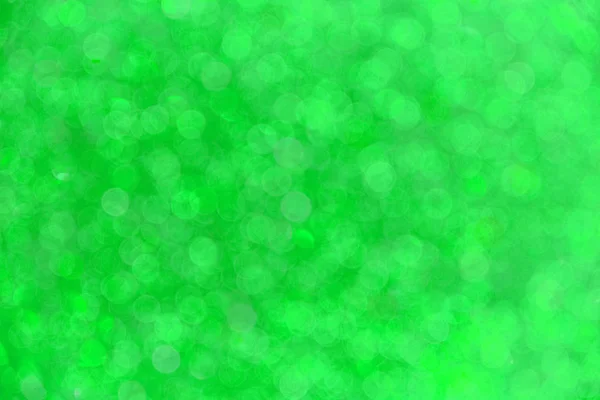 Fundo abstrato com bokeh borrado em verde . — Fotografia de Stock