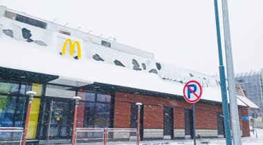 Kazakhstan, Kostanay McDonald's diner, severe snowstorm in winter. Sign Parking is prohibited.