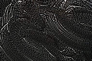 Soyut bir arkaplan, bir paçavradan köpükle kaplı cam..