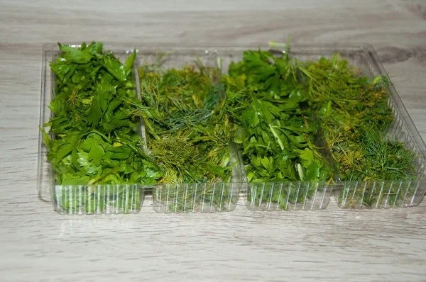 Pieces of dill and parsley in box — Stock Photo, Image