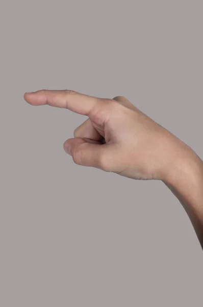 Человеческая рука показывает указательным пальцем — стоковое фото