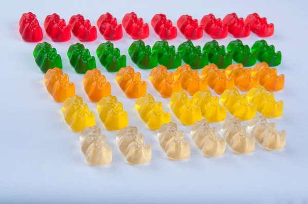 Számos tarka zselatin édességek, fehér háttér — Stock Fotó