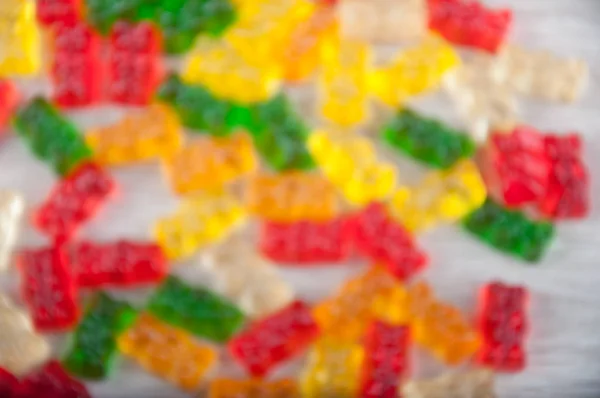 Homályos minta halom tarka gumimaci édességek — Stock Fotó