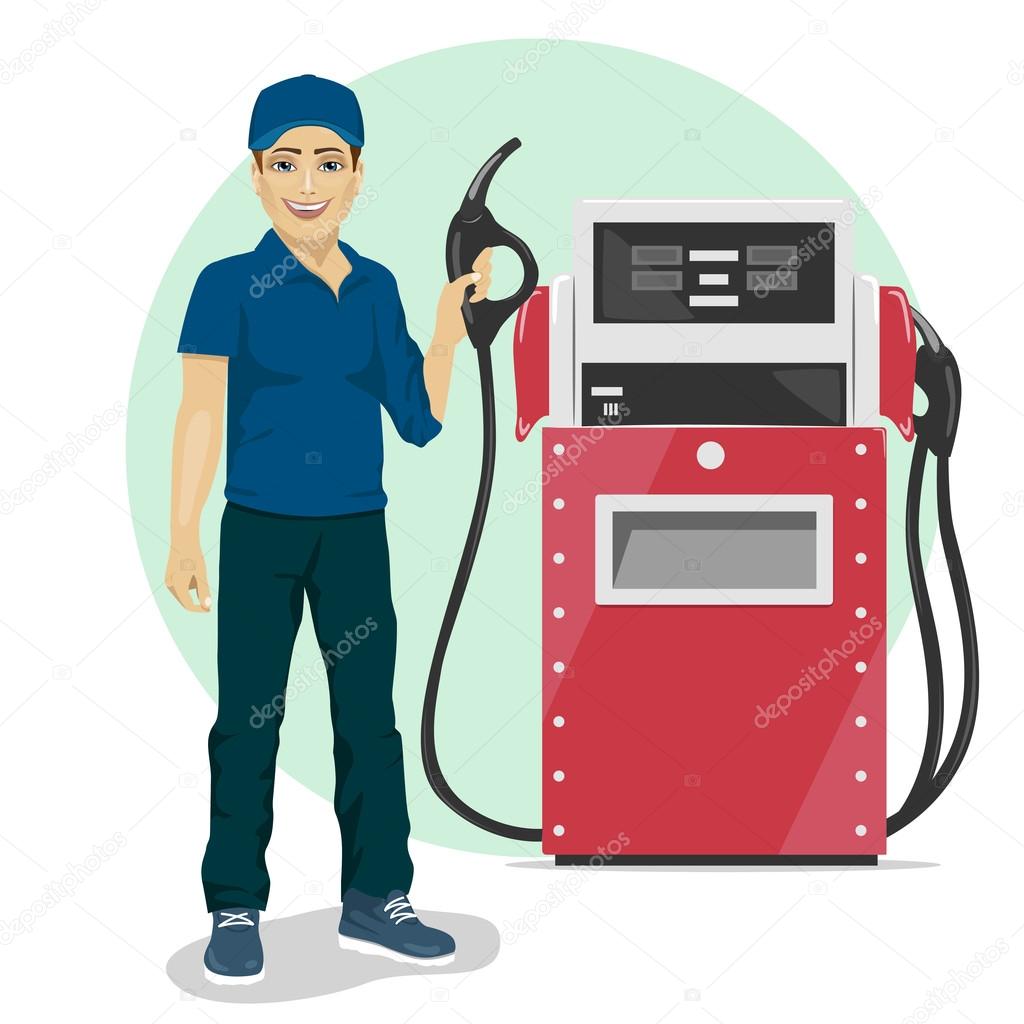 Gas station worker holding petrol pump standing next to fuel dispenser