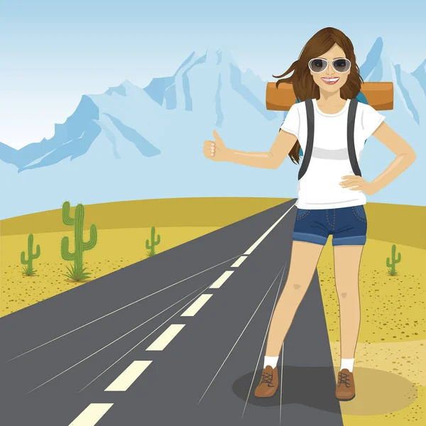 Hitchhiking woman with backpack and sunglasses standing on highway in mountains. Adventure and tourism concept. — Stock Vector
