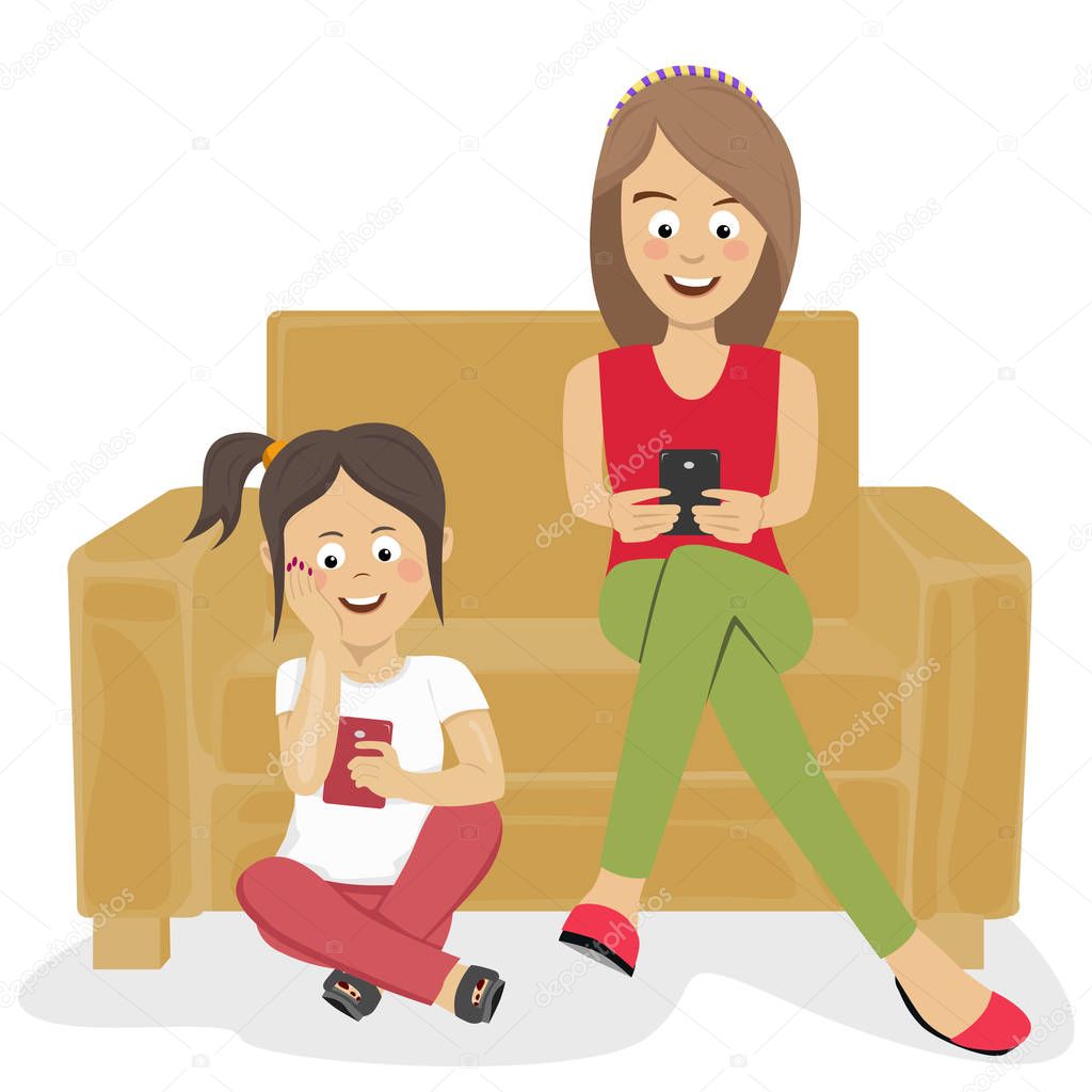 Teenagers girls or sisters using their smartphones sitting on sofa and floor