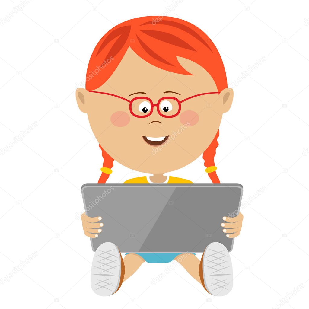 Young cute little girl using a tablet computer
