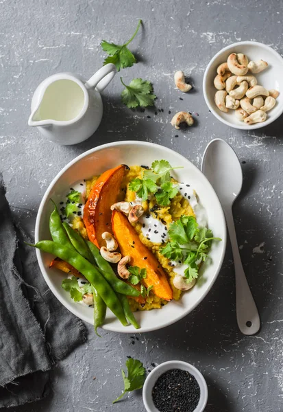Pumpkin dhal. Traditional indian leguminous vegetables soup. Healthy vegetarian food concept. On a gray background, top view — Stock Image Pumpkin dhal. Traditional indian leguminous vegetables soup. Healthy vegetarian food concept. On a gray background, top view Stock Picture