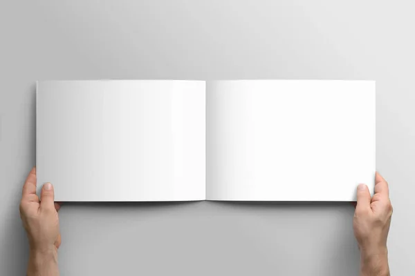 Blank A4 photorealistic landscape brochure mockup on light grey background. — Stock Photo, Image