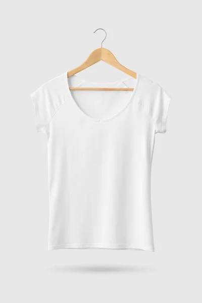Blank White Women's T-Shirt Mock-up on wooden hanger, front side view. 3D Rendering.