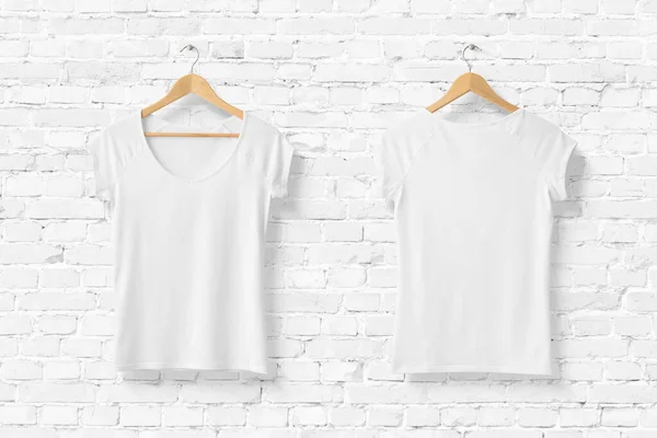 Blank White Women\'s T-Shirt Mock-up on wooden hanger, front and rear side view. 3D Rendering.
