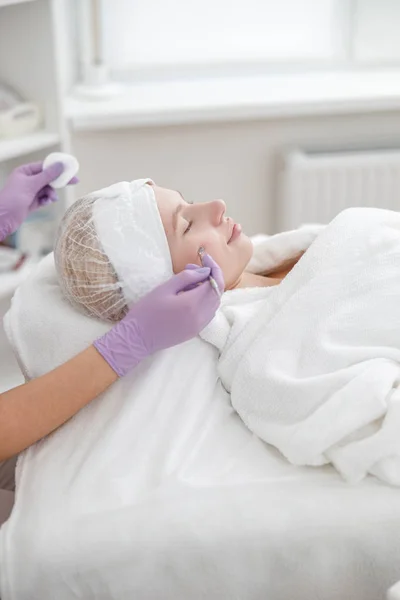 Woman in cosmetology center