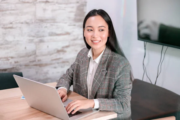 asian woman working in office