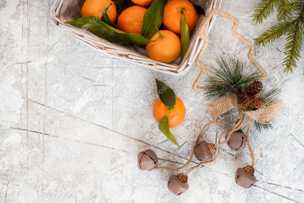 Mandarins in basket with Gift and Christmas tree branch