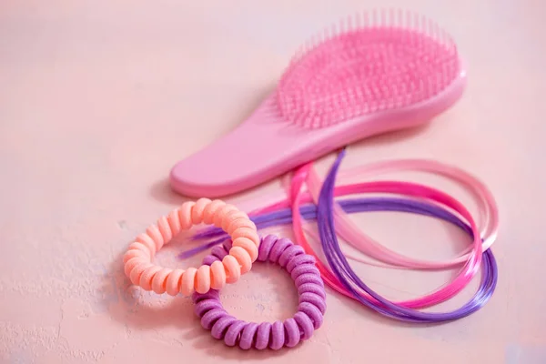 Light pink comb, purple decorative hair for girls hairstyles. Decoration for teenage girls. Silicone rubber band