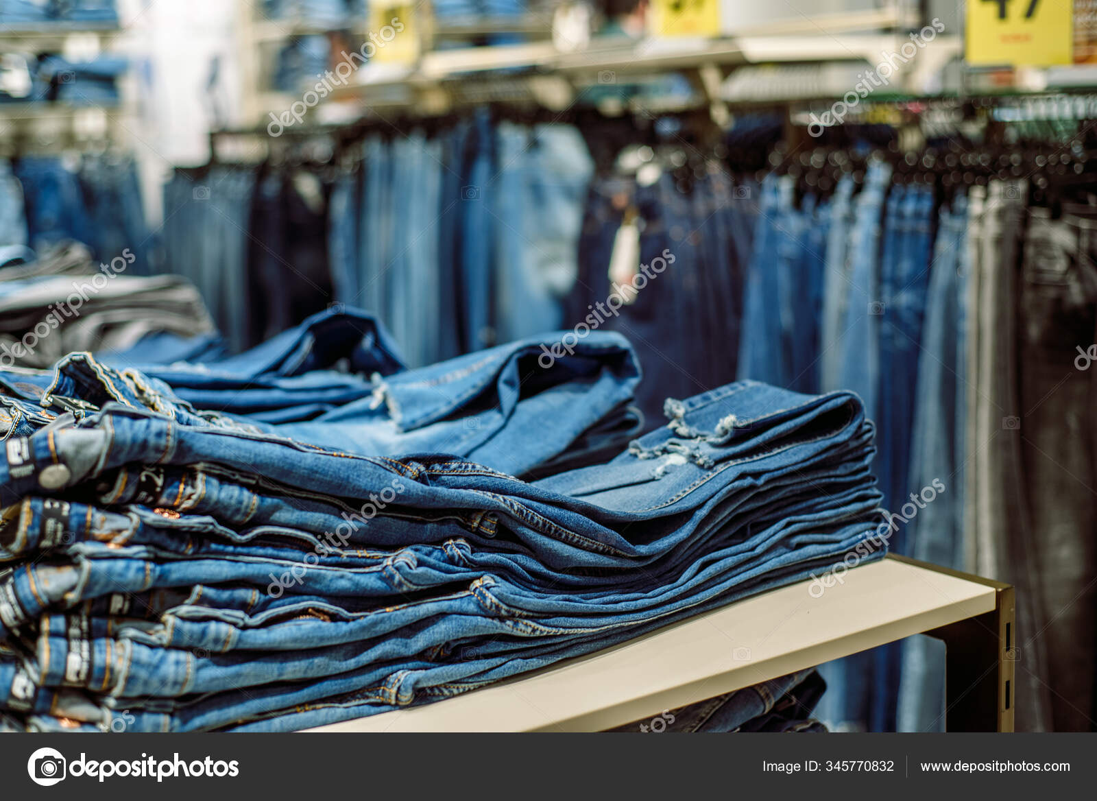Jeans store in a shopping Denim sales. Blue pants. Shopping for Stock by ©Irishasel 345770832